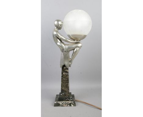 After Max Le Verrier (1891–1973), an Art Deco style table lamp formed as a female figure in a seated position holding a crack