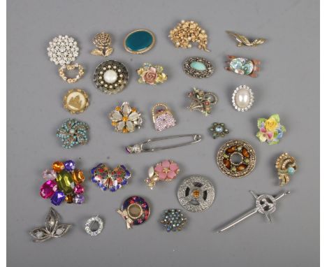 A collection of approx. 30 costume jewellery brooches to include Celtic, Abalone, floral and gemstone examples.  