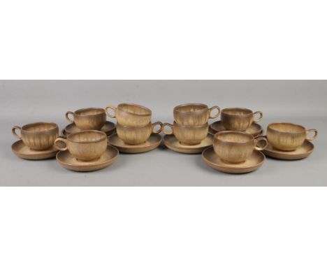 A quantity of Denby cups and saucers in the Romany pattern.  