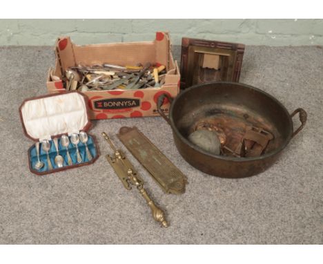 A collection of metalwares including a large quantity of cutlery including silver plate and a large copper pot, brass items i
