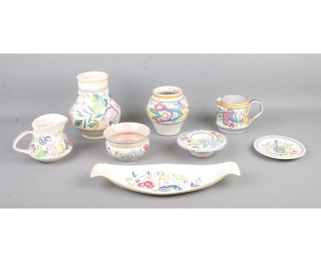 A collection of Poole pottery including vases, candle holder and shallow dish.  Rim of one vase cracked.
