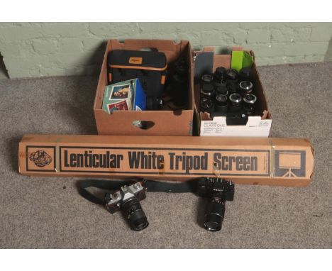 A collection of assorted cameras and lenses to include Praktica MTL3, Zenit 122 Hanimex, Pentagon, etc. Along with a set of P
