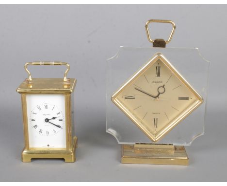 A Bayard French 8-Day carriage clock along with a Seiko quartz clock.  Bayard clock is missing front glass but is working.