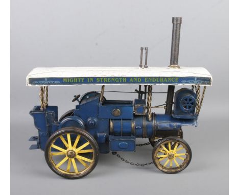 A boxed model steam engine in yellow, white and blue beating motto 'Mighty in Strength and Endurance'. Approx. length 31cm.  