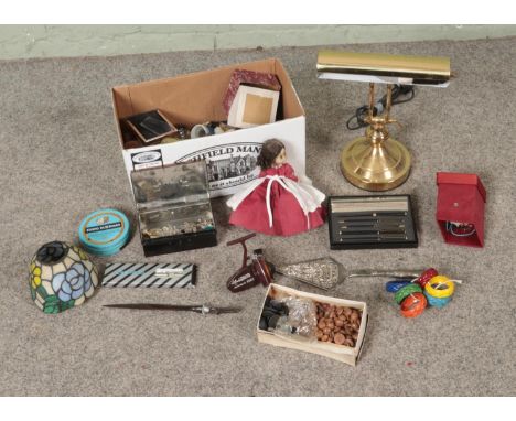 A box of miscellaneous to include costume jewellery, vintage desk lamp, Tiffany style lamp shade, Norris Shakespeare fishing 