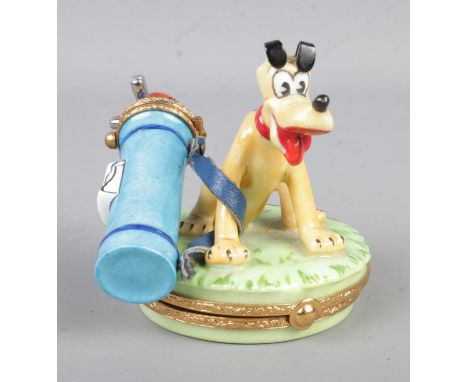 A rare Artoria Limoges hand painted trinket box, 'Canine Caddy', formed as Disney's Pluto with golf bag. Signed to base 'Arto