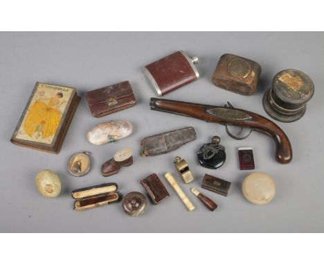 A tray of mixed antique and vintage collectables including replica flintlock pistol, cheroot holder, scent bottle, novelty sn