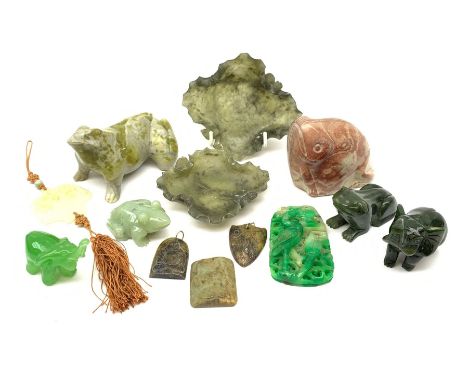 A group of jade, soapstone and hardstone, to include a jade pendant, jade frog, three soapstone pendants, nephrite jade eleph