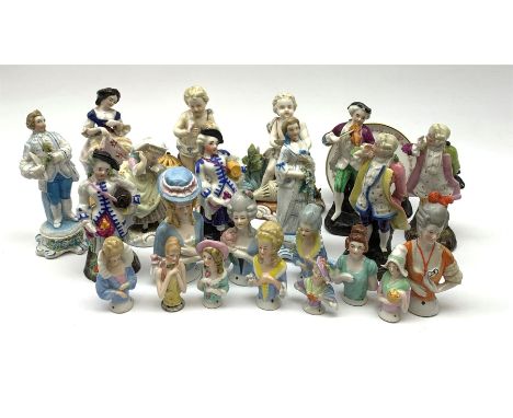 A collection of Continental porcelain pin cushion dolls, Sitzendorf figure of a girl together with other porcelain figuresCli