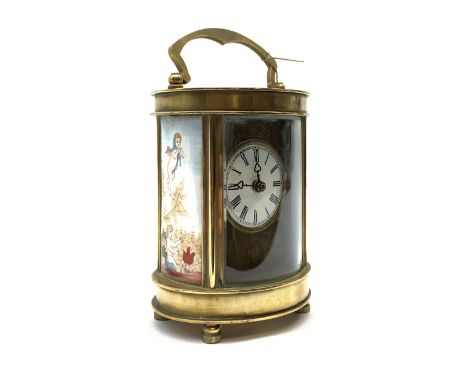 Late 20th Century brass cased carriage time piece clock, oval form set with circular Roman dial and painted enamel panels at 