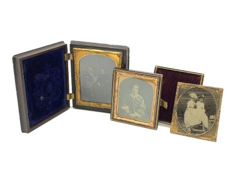 A Victorian ambrotype photograph in gilt surround and Vulcanite type Union case, decorated in low relief to front and verso w