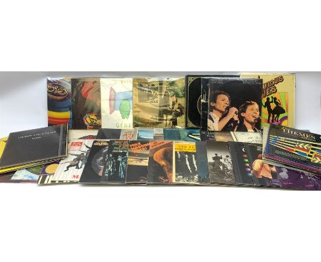 A collection of vinyl records, to include The best of Donna Summer live and more, Madness presents The Rise &amp; Fall, Beege