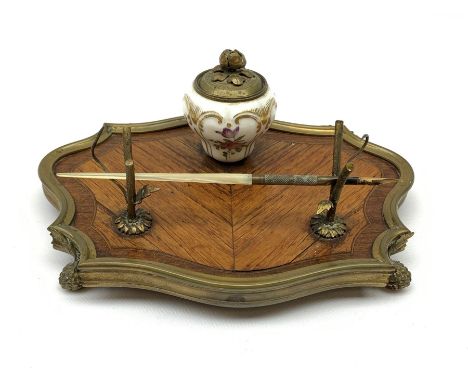 A 19th century desk stand, the porcelain inkwell painted with floral sprigs and heightened with gild, and cover with bud fini