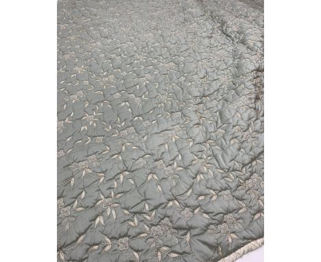 A large light blue quilt embroidered in silver thread with flowers, approximately 260cm x 245cm.Click here to view further im