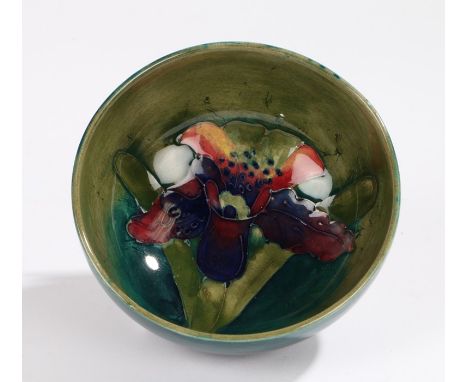 Moorcroft dish the green ground with iris decoration, facsimile W.M. Moorcroft signature to base and stamped "potter to H.M t