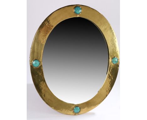 Ruskin style wall mirror, the beaten brass frame with four turquoise porcelain roundels and copper studs to the outer edge, 5