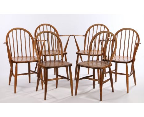 Four Ercol elbow chairs, with turned spindle backs and arm supports, solid dished seats, on turned legs, together with a pair