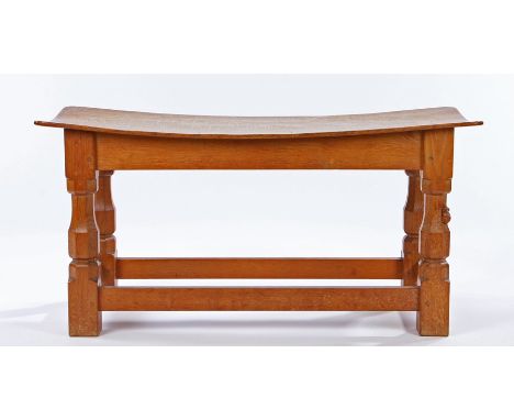 1930's Robert "Mouseman" Thompson of Kilburn oak stool, the dished rectangular top raised on four chamfered octagonal and squ