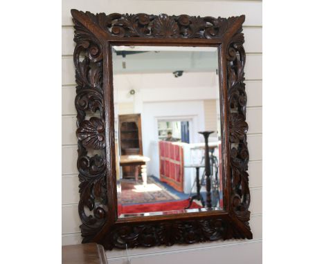 An oak framed mirror, H.82cm