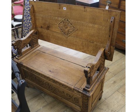 An oak monks bench, W.107cm
