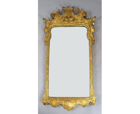 A mid 18th century style gilt gesso wall mirror, with Prince of Wales feather crest and bevelled plate, W.2ft 7in. H.4ft 8in.