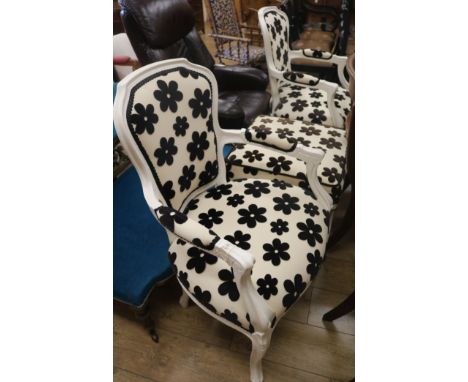 Two spotted armchairs and a foot stool