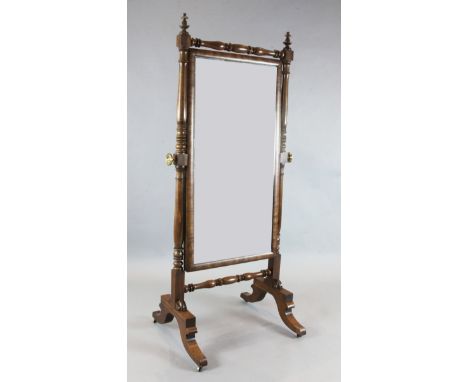 A Regency mahogany cheval mirror, with turned frame and trestle feet, W.2ft 7in. H.5ft 8in.