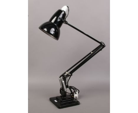 A black angle poise desk lamp on stepped base, Herbert Terry &amp; Sons Ltd Redditch.