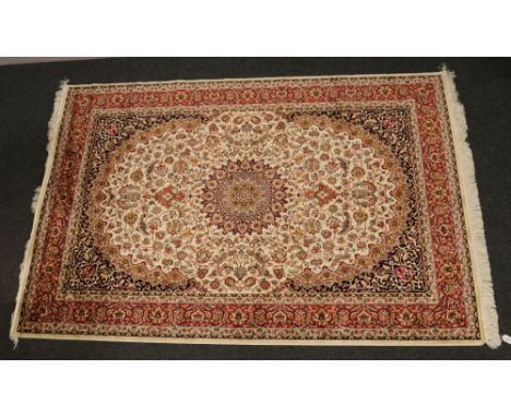 A beige ground Keshan carpet, 230cm x 160cm.