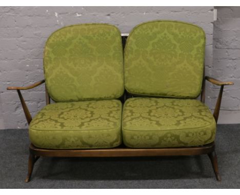 An Ercol two seater spindle back settee.