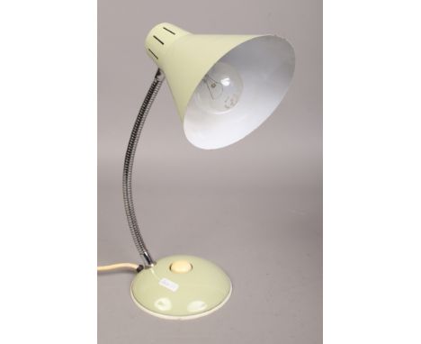 A vintage desk lamp with conical shade.