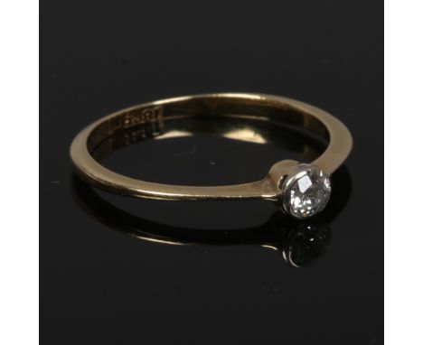 An 18ct gold solitaire diamond ring in collet setting approximately 0.2ct, size N 1/2.