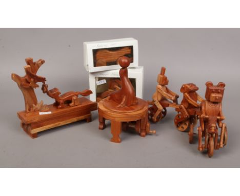 A group of carved hardwood amusing ornaments animal pull along, fox and chicken seal rotary balance, monkey cycler and runnin