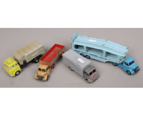 A Dinky Diecast Pullmore car transporter, two Dinky Bedford lorries and a Dinky refuse wagon.