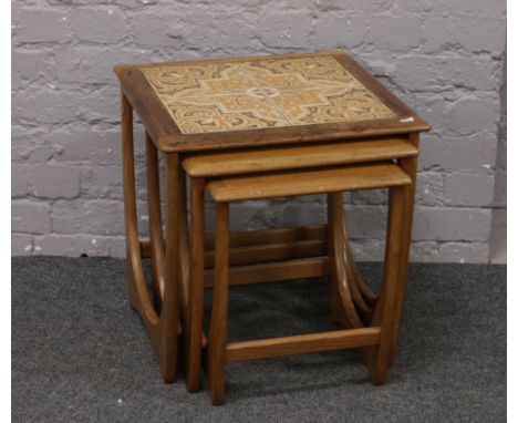 A nest of three G plan tile top tables.