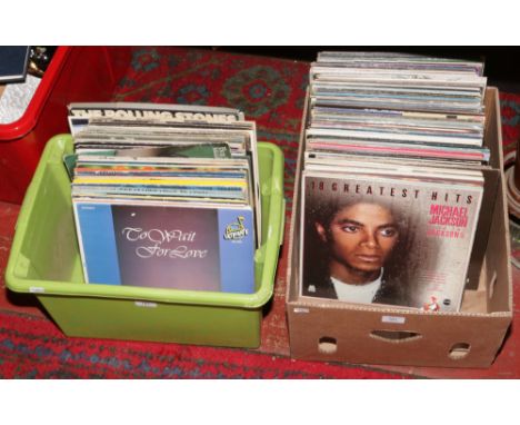 Two boxes of mainly pop and rock L.P records to include The Beatles, The Rolling Stones, Alice Cooper, Rod Stewart etc.