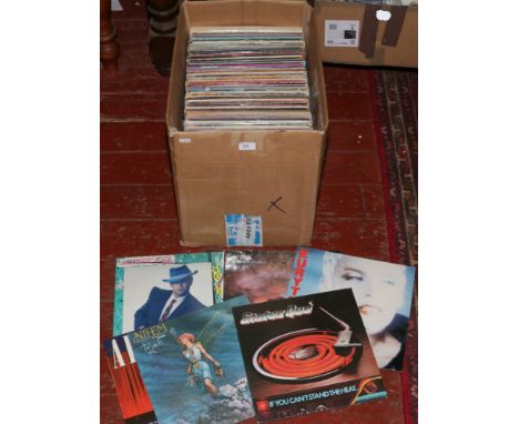 A box of L.P records to include Rolling Stones, The Beatles, David Bowie etc.