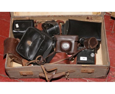 A vintage suitcase and contents of photographic equipment including Kodak Six-20 Brownie E, Ilford Sportsman, AGFA etc.