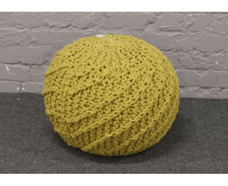 A Habitat mustard coloured knot pouffe.