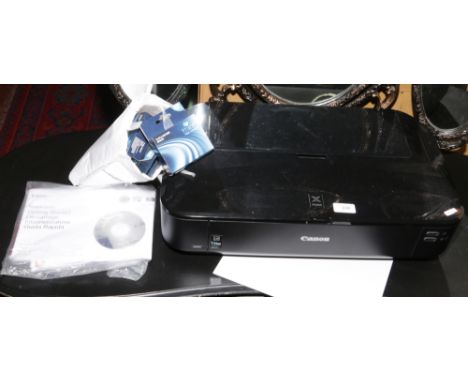 A Canon Pixma printer photo and A3 printing with manual, cables and a range of Canon compatible ink cartridges.