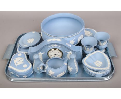 A tray of assorted Wedgwood blue Jasperware including mantel clock, pedestal bowl and cruet etc.