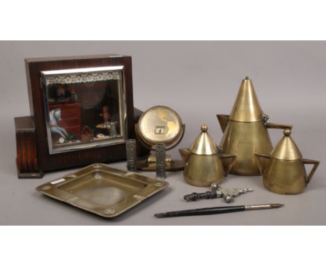 An antique shop diorama housed in an oak mantel clock case along with various metalwares including Arts &amp; Crafts teaset, 
