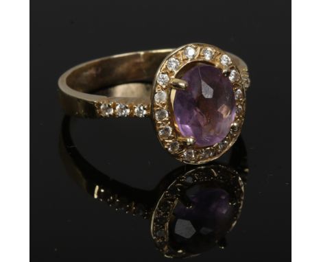 A large 14ct gold amethyst and white paste dress ring.