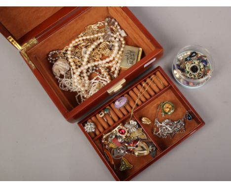 A jewellery box and assorted costume jewellery including simulated pearls, dress rings and enamel badges etc.