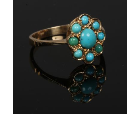 An 18ct gold and turquoise cluster ring, size K.