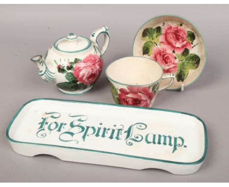 A Wemyss rectangular tray inscribed For Spirit Lamp along with a Wemyss bachelors teapot and cover and breakfast cup and sauc