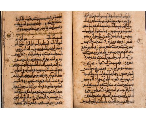An Eastern Kufic Qur'an section (juz)Near East, 12th century . . Cm 18,00 x 28,00. Text: Surah from no. 12 to no. 16.Arabic m