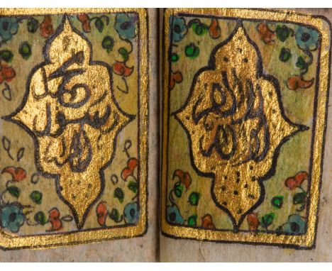 Pocket Quran dated 1201 (1787 AD) copied by Mohammad GhisehLate 18th century . . Cm 3,00 x 3,80 x 3,00. Arabic manuscript on 