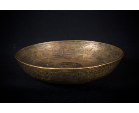 A brass engraved magic bowlPossibly Egypt, late18th century. . Cm 17,50 x 4,00.