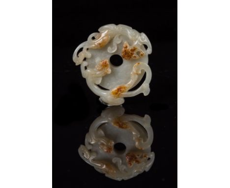 A jade disc carved with chilong China, 19th century . . Cm 5,00.